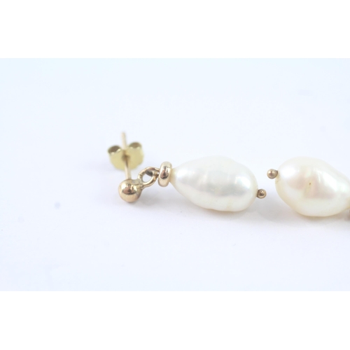 2011 - A pair of 9ct gold baroque pearl drop stud earrings - approx. gross weight 2g