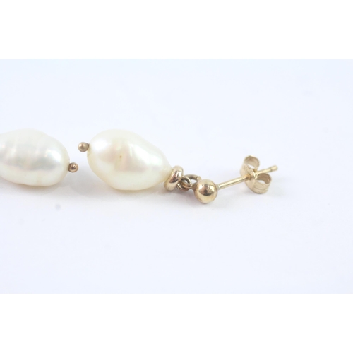 2011 - A pair of 9ct gold baroque pearl drop stud earrings - approx. gross weight 2g