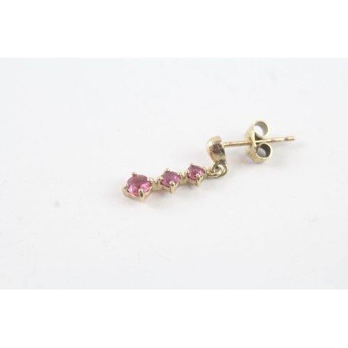 2014 - A pair of 9ct gold ruby three stone drop earrings - approx. gross weight 1g