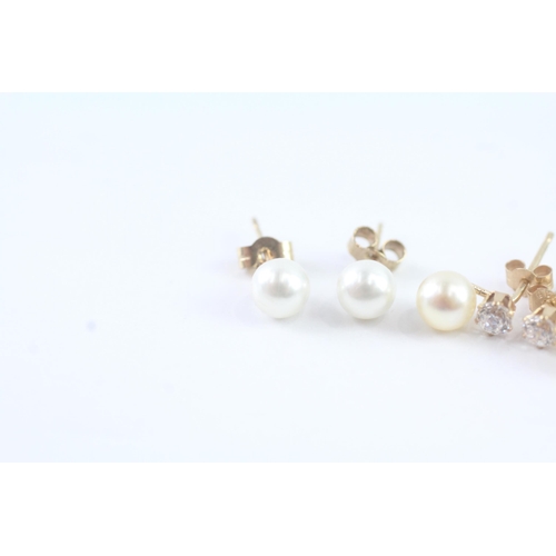 2025 - Two pairs of 9ct gold faux pearl and CZ stud earrings - approx. gross weight 1g