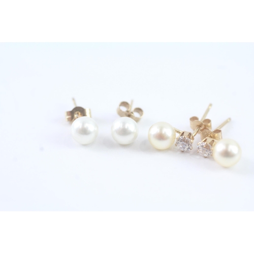 2025 - Two pairs of 9ct gold faux pearl and CZ stud earrings - approx. gross weight 1g