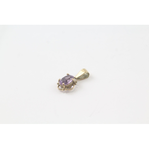 2030 - Two 9ct gold amethyst single stone pendants - approx. gross weight 1g