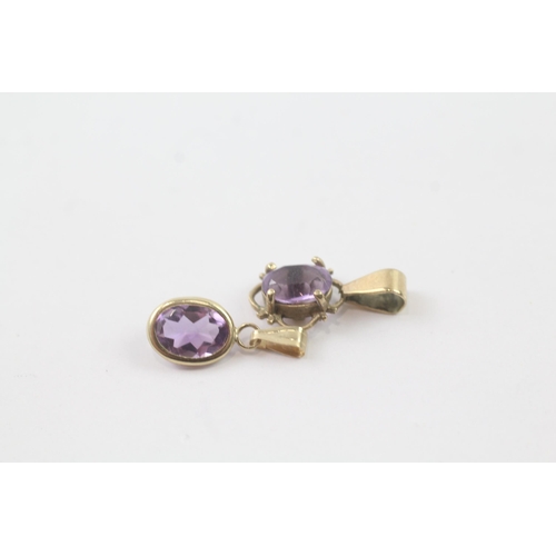 2030 - Two 9ct gold amethyst single stone pendants - approx. gross weight 1g