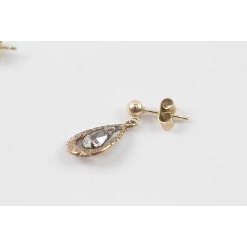 2032 - A pair of 9ct gold clear paste patterned drop earrings - approx. gross weight 2g