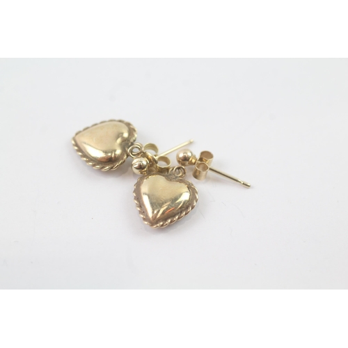 2033 - A pair of 9ct gold patterned heart shape drop earrings - approx. gross weight 1.2g