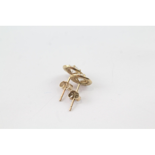 2037 - A pair of 9ct gold CZ halo stud earrings - approx. gross weight 0.8g