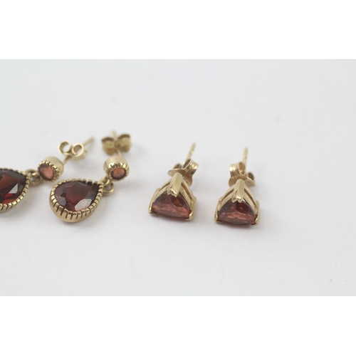 2041 - Two pairs of 9ct gold garnet drop and stud earrings - approx. gross weight 3.1g