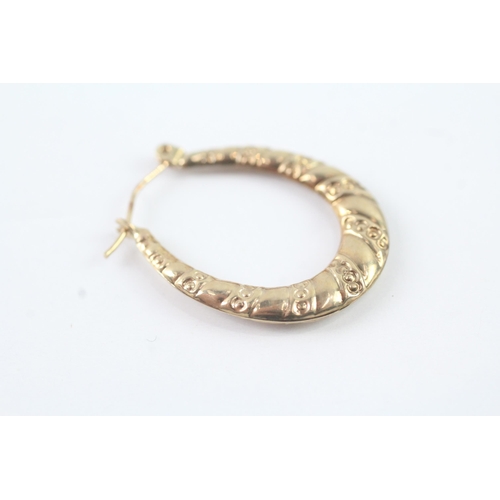 2049 - A pair of 9ct gold hollow hinged hoop earrings - approx. gross weight 1g