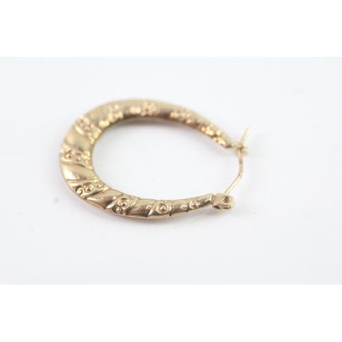 2049 - A pair of 9ct gold hollow hinged hoop earrings - approx. gross weight 1g