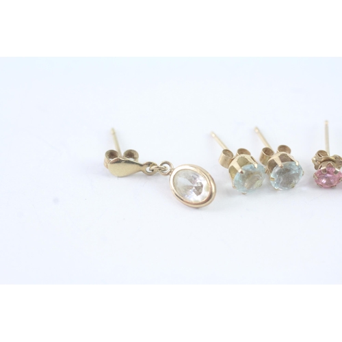 2051 - Three pairs of 9ct gold CZ earrings - approx. gross weight 1.7g