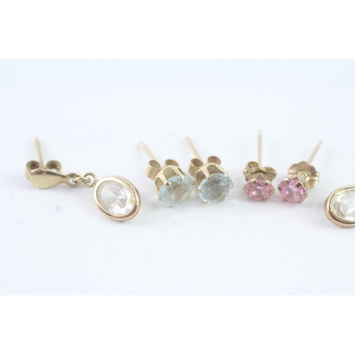 2051 - Three pairs of 9ct gold CZ earrings - approx. gross weight 1.7g