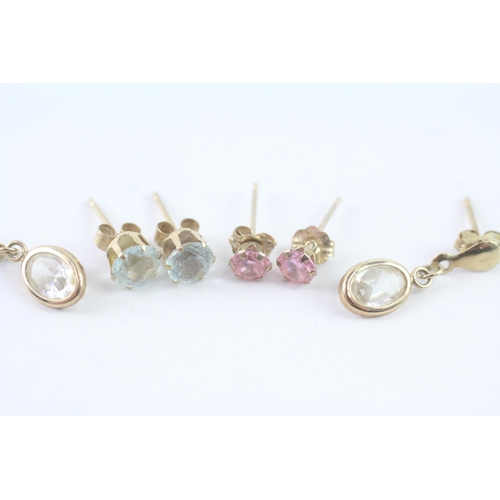 2051 - Three pairs of 9ct gold CZ earrings - approx. gross weight 1.7g