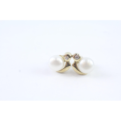 2052 - A pair of 9ct gold cultured pearl and CZ stud earrings - approx. gross weight 1.4g