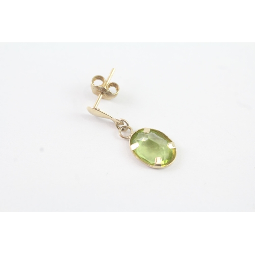 2053 - A pair of 9ct gold peridot drop single stone earrings - approx. gross weight 0.8g