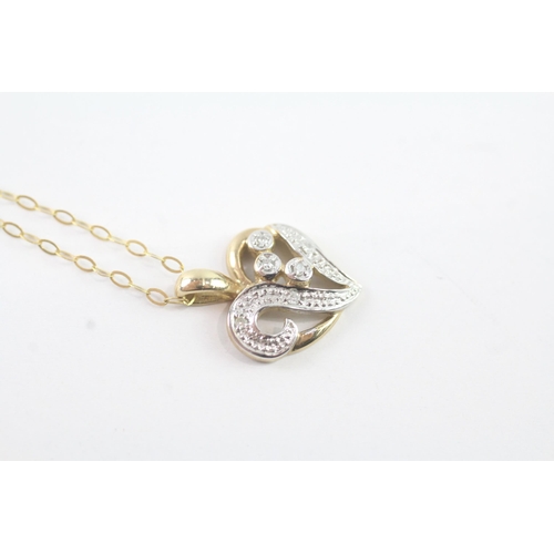 2054 - A 9ct gold diamond heart pendant on chain - approx. gross weight 1.6g