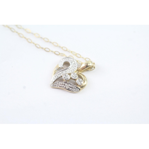 2054 - A 9ct gold diamond heart pendant on chain - approx. gross weight 1.6g