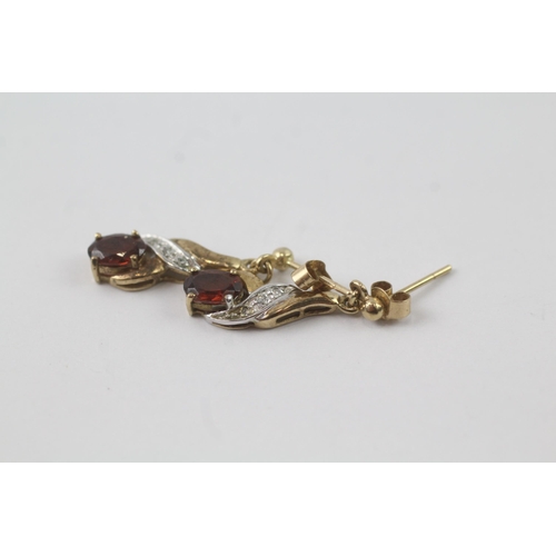 2056 - A pair of 9ct gold garnet and diamond drop dress earrings - approx. gross weight 1.8g