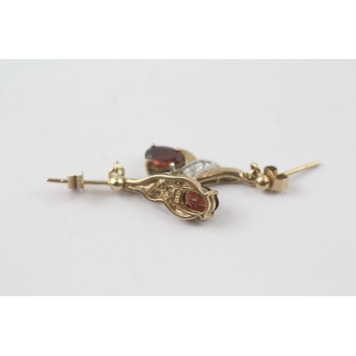 2056 - A pair of 9ct gold garnet and diamond drop dress earrings - approx. gross weight 1.8g