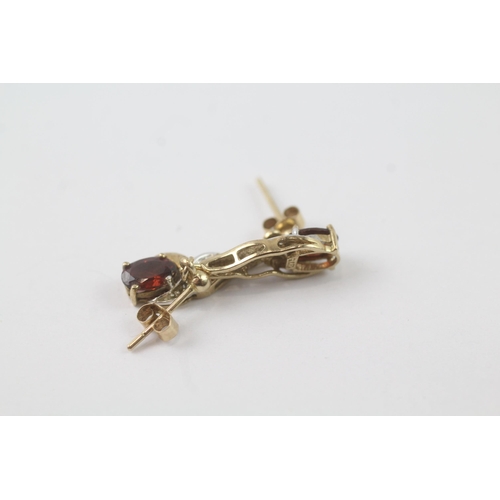 2056 - A pair of 9ct gold garnet and diamond drop dress earrings - approx. gross weight 1.8g