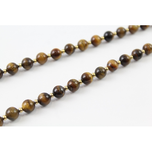 2063 - A tiger's eye beaded necklace with 9ct gold clasp and spacers - approx. gross weight 35g