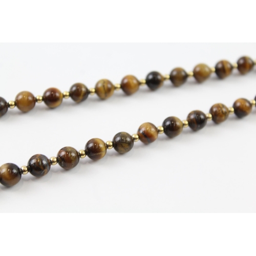 2063 - A tiger's eye beaded necklace with 9ct gold clasp and spacers - approx. gross weight 35g