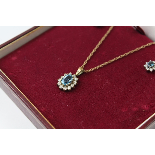 2070 - A boxed 9ct gold blue and white gemstone halo earring and necklace set - approx. gross weight 2.7g