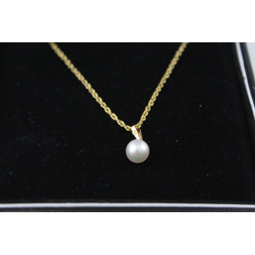 2071 - A boxed 9ct gold cultured pearl stud earring and necklace set - approx. gross weight 3.8g