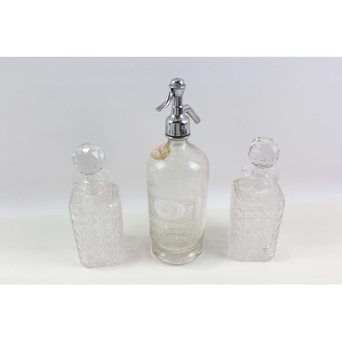 1275 - Three pieces of glassware, one mid 20th century Hanbury & Cotching soda syphon and a pair of cut gla... 