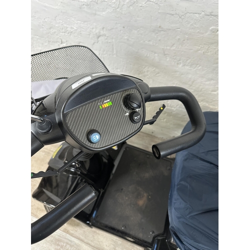 1562A - A Rascal Vantage mobility scooter with charger