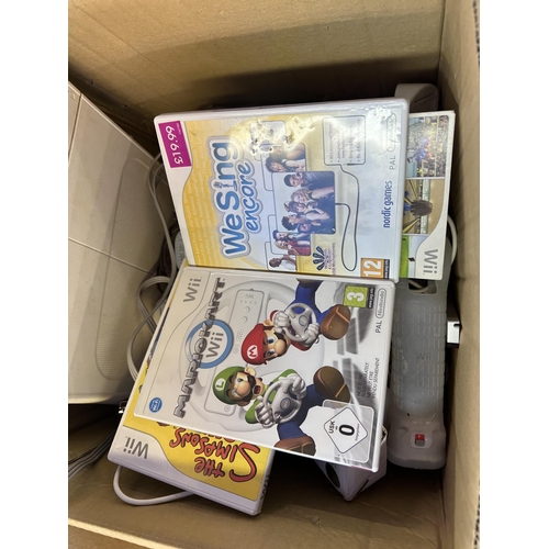 1540 - A collection of Nintendo Wii consoles and accessories to include Mario Kart, Wii Fit board, Call Of ... 