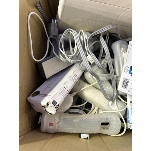 1540 - A collection of Nintendo Wii consoles and accessories to include Mario Kart, Wii Fit board, Call Of ... 