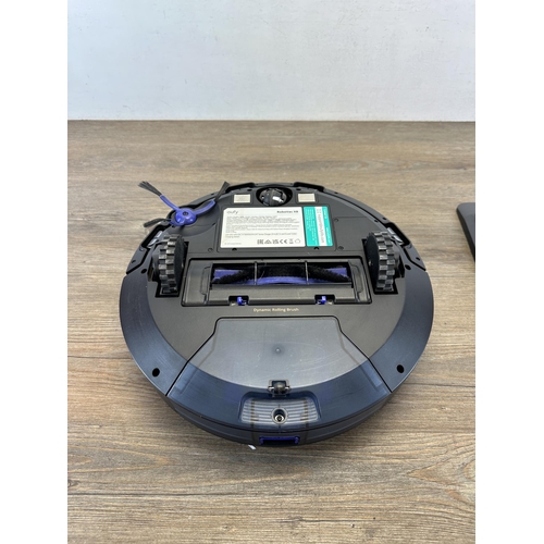 1543 - A Oufy RoboVac robot vacuum cleaner