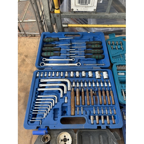 1579 - Four cases containing socket sets, Makita drill bit set, Draper Expert set, Sealy, screwdrivers, hol... 