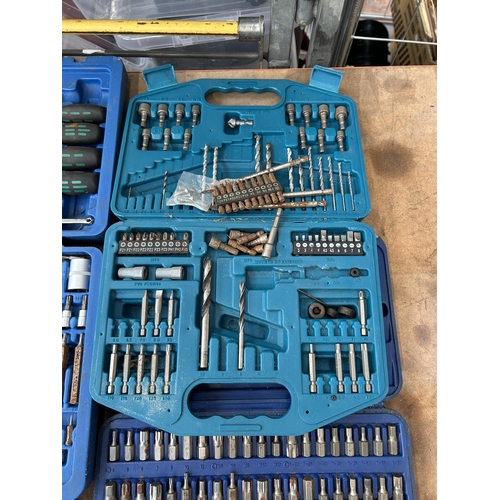 1579 - Four cases containing socket sets, Makita drill bit set, Draper Expert set, Sealy, screwdrivers, hol... 