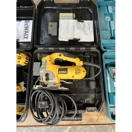 1583 - Three cased power tools, one Makita 8443D combi drill, one cased DeWalt DC925 combi drill and one De... 