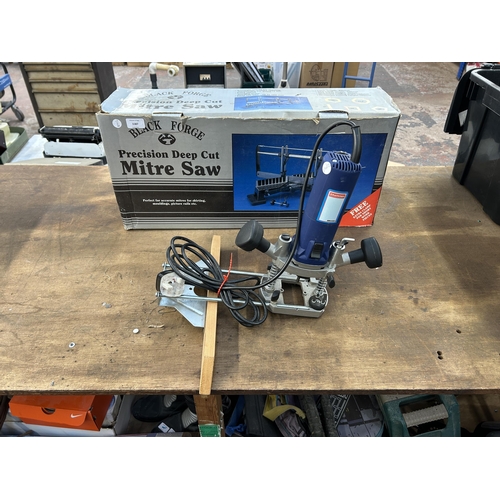 1587 - Two items, one boxed Black Forge mitre saw and one Challenge MR3364 router