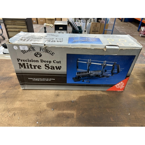 1587 - Two items, one boxed Black Forge mitre saw and one Challenge MR3364 router