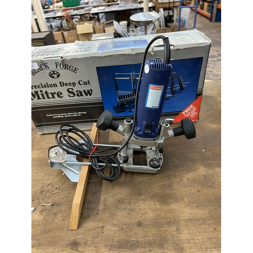 1587 - Two items, one boxed Black Forge mitre saw and one Challenge MR3364 router