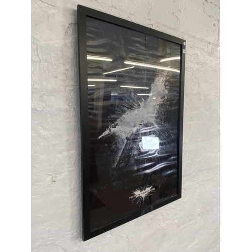 1476 - A framed DC comics movie poster Batman 'The Dark Knight Rises' measures 96.5 cm x 66 cm.