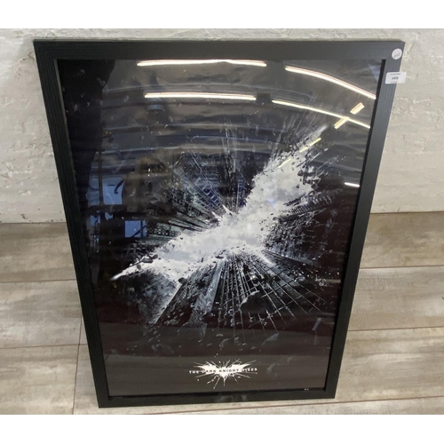 1476 - A framed DC comics movie poster Batman 'The Dark Knight Rises' measures 96.5 cm x 66 cm.