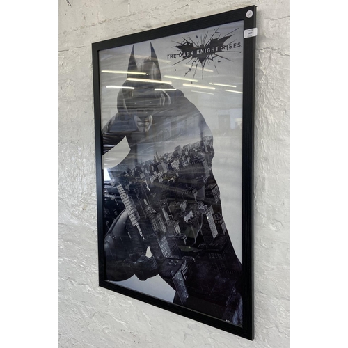 1477 - A framed DC comics movie poster Batman 'The Dark Knight Rises' measures 96.5 cm x 66 cm.