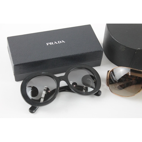 1358 - Three pairs of cased sunglasses to include Prada etc.