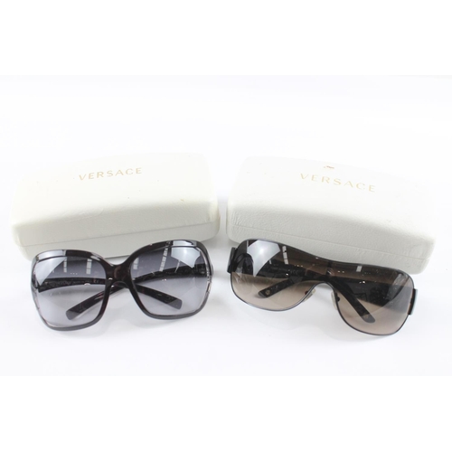 1363 - Two pairs of cased Versace sunglasses