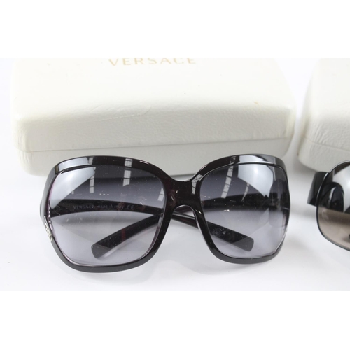 1363 - Two pairs of cased Versace sunglasses