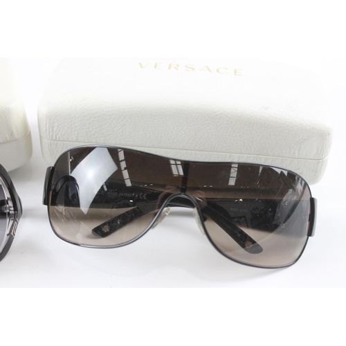 1363 - Two pairs of cased Versace sunglasses