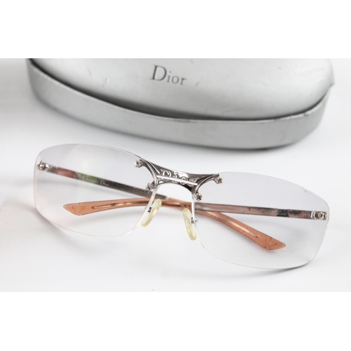 1368 - Two pairs of cased Christian Dior eyewear, one prescription glasses and one sunglasses