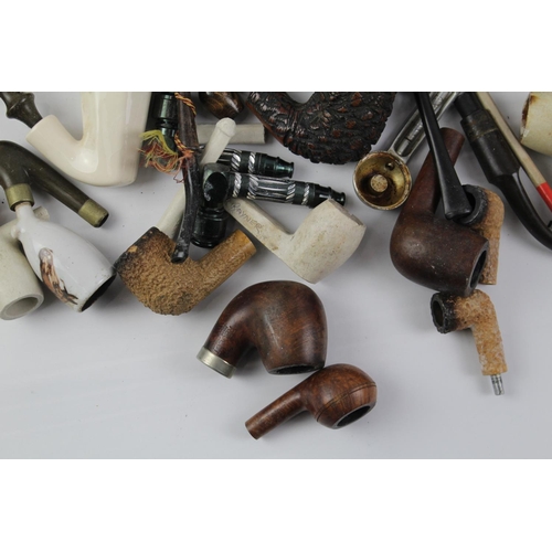 1423 - A collection of estate pipe parts to include stems etc.