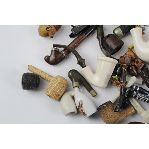 1423 - A collection of estate pipe parts to include stems etc.