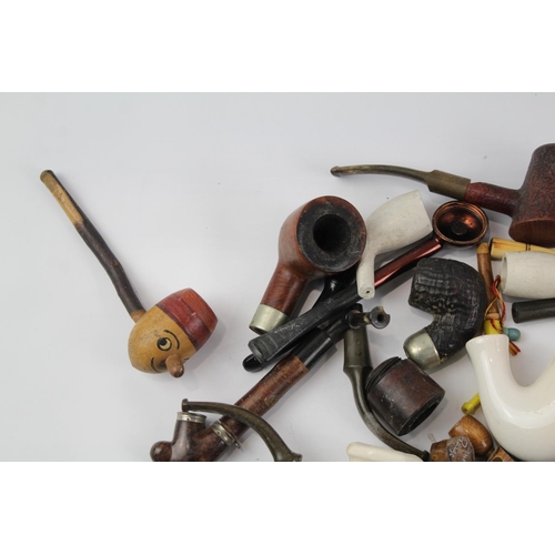 1423 - A collection of estate pipe parts to include stems etc.