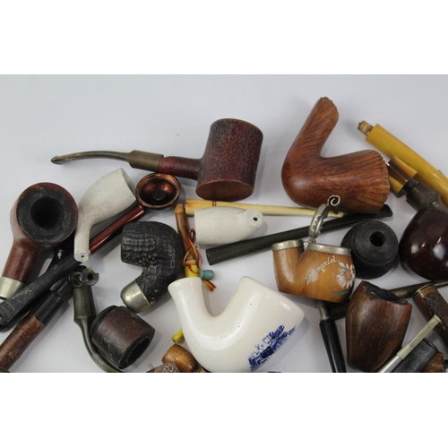 1423 - A collection of estate pipe parts to include stems etc.